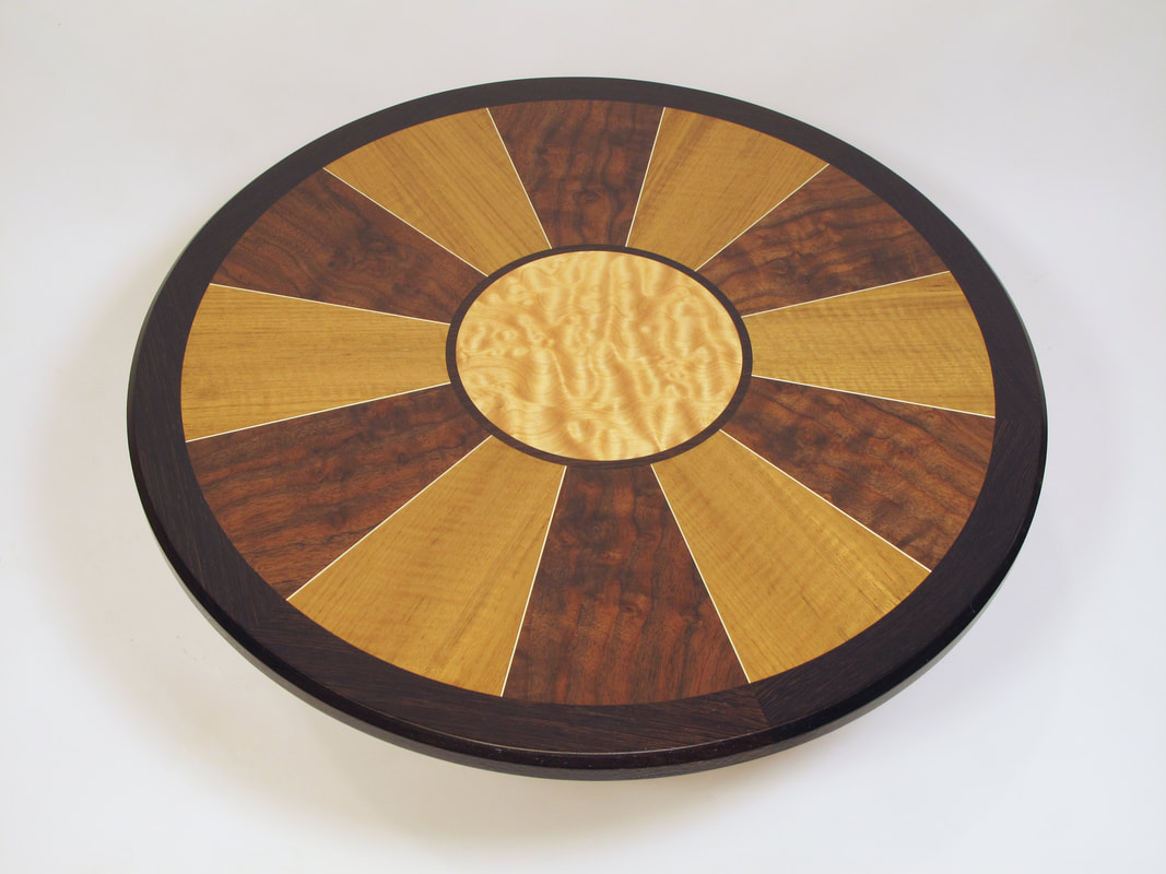 Round table top with teak, walnut and quilted maple veneers